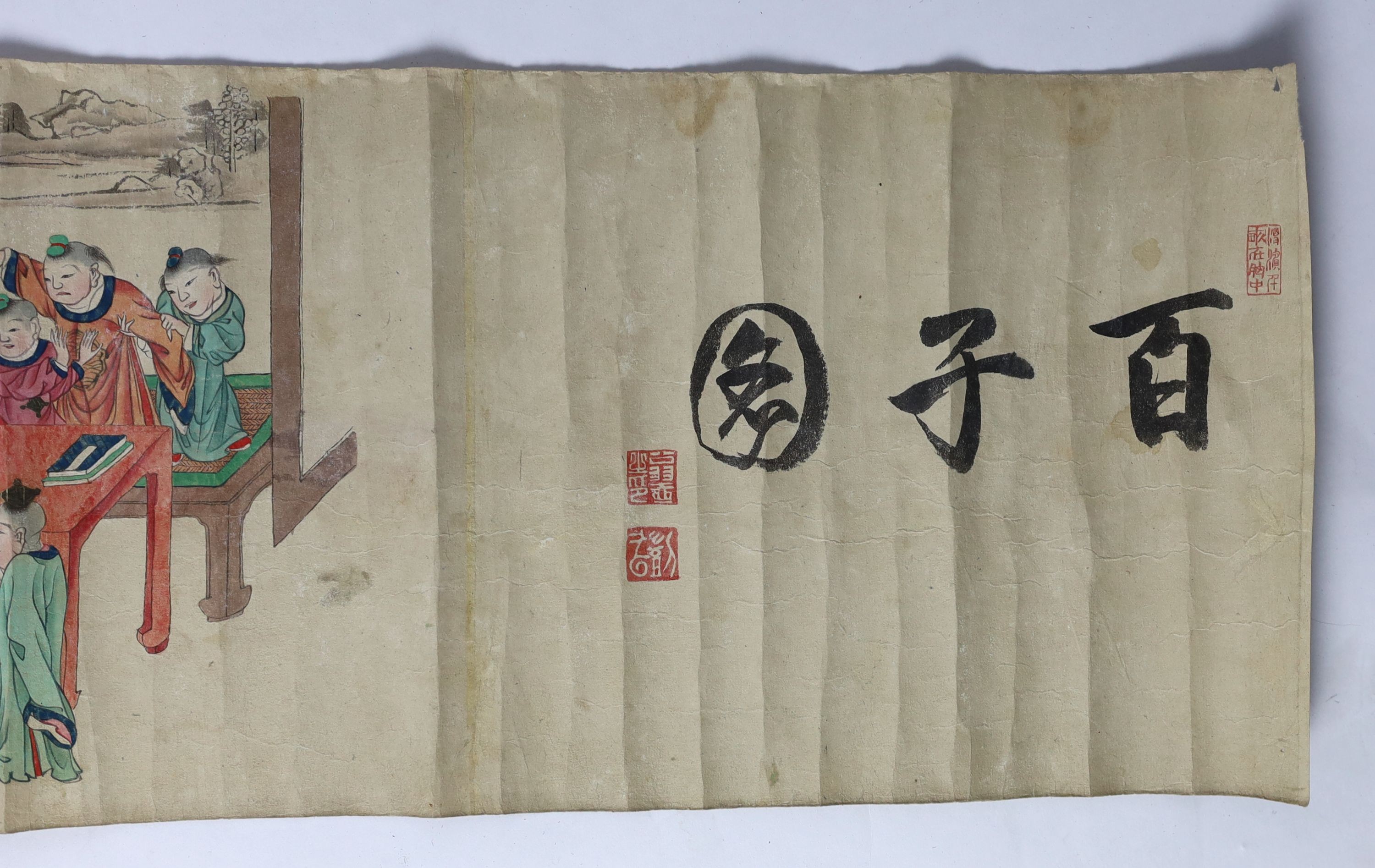 A Chinese handscroll painting on paper of ‘Hundred boys’ in a garden, late Qing dynasty, image 570cm x 26cm
